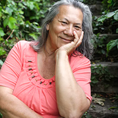 Older woman relaxing outdoors after depression treatment
